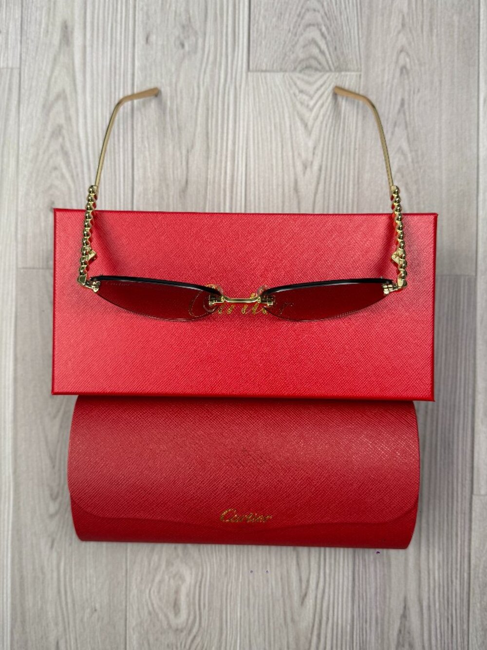 Premium Rimless Fashion Sunglasses, Gold Chain Detail Temples Red Tinted Lens De